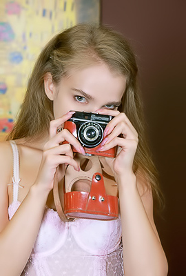 Xenia Glancing Back Over Her Shoulder With A Flirtatious Smile