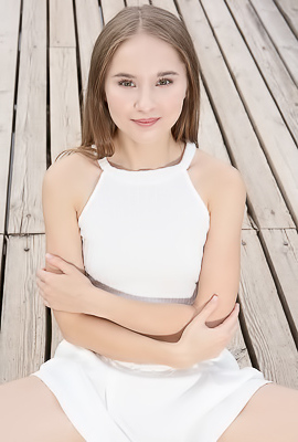 Sasha Quinn Smiling Playfully As Her Short Skirt Flips Up To Reveal She’s Not Wearing Panties