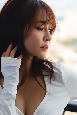 Tonnam yields to natures call, exposing herself on the open balcony to the captivating city view