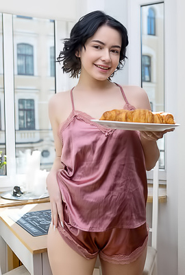 Baiba Her Curly Black Hair Framing Her Face Like Playful Ink Strokes On Porcelain