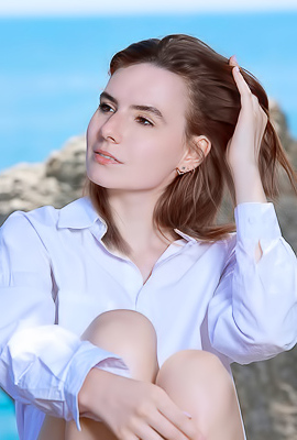 Nika Smiling With Pleasure As The Stimulating Ocean Breeze Caresses Her Sexy Body